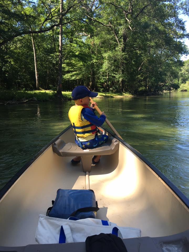 Kid Riding Canoe